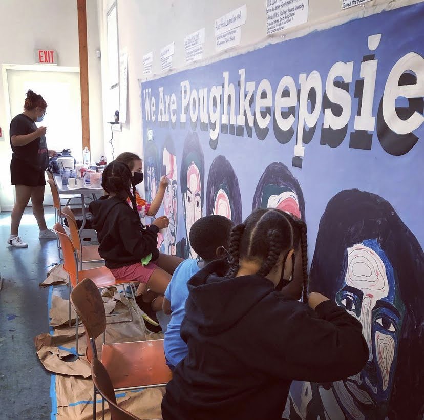 Students working on We Are Poughkeepsie Mural at The Art Effect